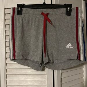 Gray adidas shorts with red, white, and blue stripes. Size small.